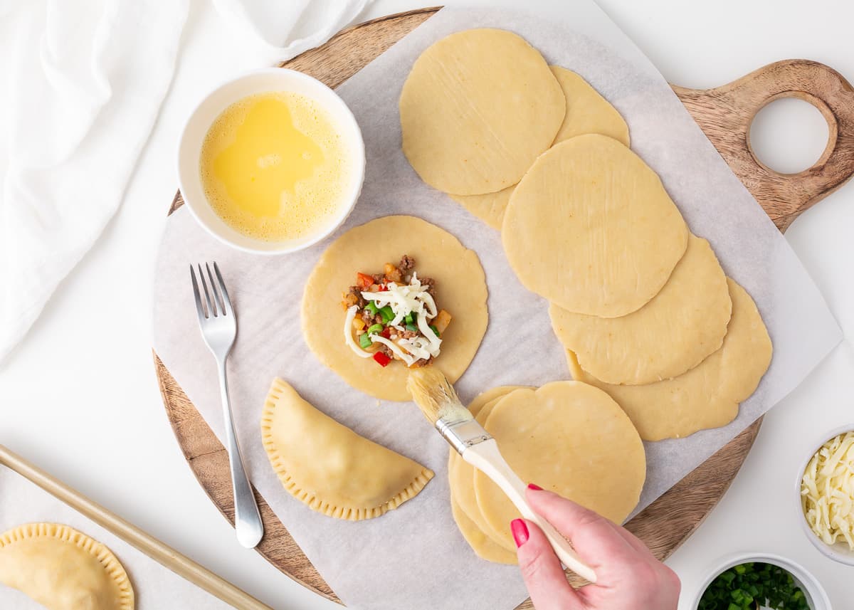 Spoon that filling into the center of your dough circles, fold over, and crimp those edges. for Empanadas