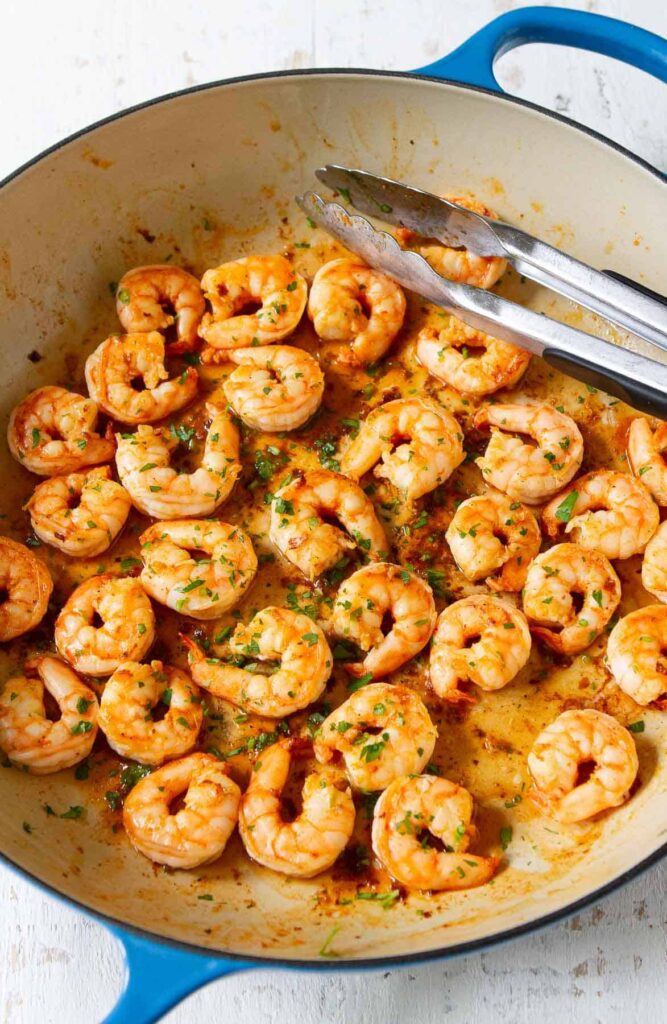 cook chopped shrimp, paprika, salt, and pepper