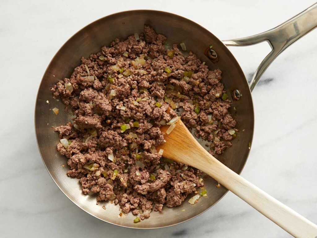 ground beef, onions and garlic, cooking until soft   