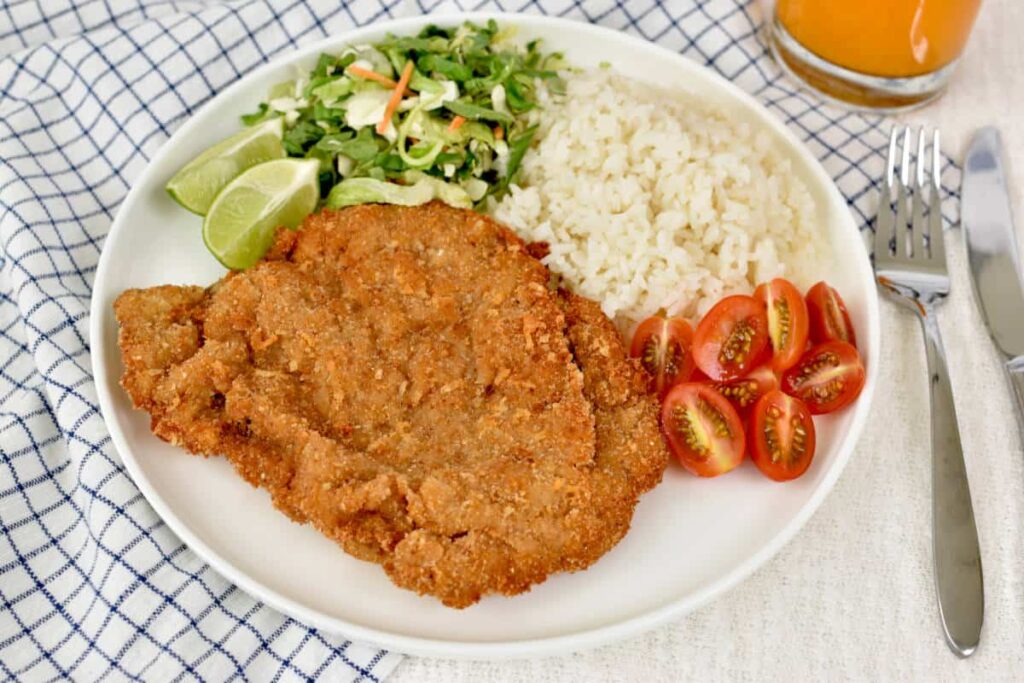 Regional variations of Milanesa