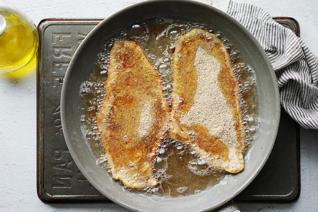 Milanesa should be fried in hot oil until golden brown