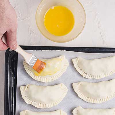 Brush the empanadas with an egg wash 